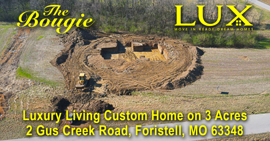 An aerial view of a construction site for a luxury custom home on a three-acre plot at 2 Gus Creek Road in Foristell, Missouri, featuring heavy machinery and the logos for "The Bougie" and "LUX."